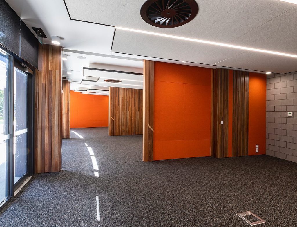 Image shows the interior room section with orange fabric of the energy efficient commercial building the National Jewish Memorial centre.