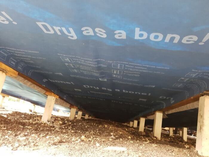 Vapour permeable wrap installed over insulation under the floor.