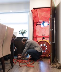Airtightess testing with a blower door installed.