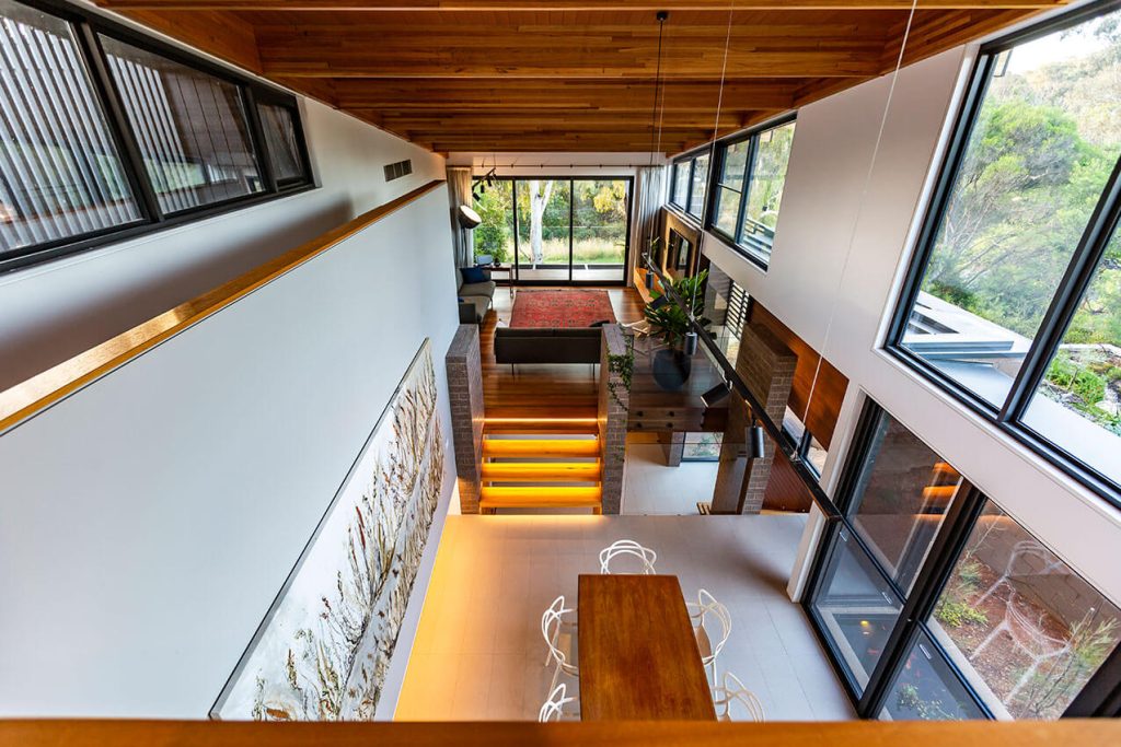Image shows the interior of a modern, energy efficient home with timber ceiling.