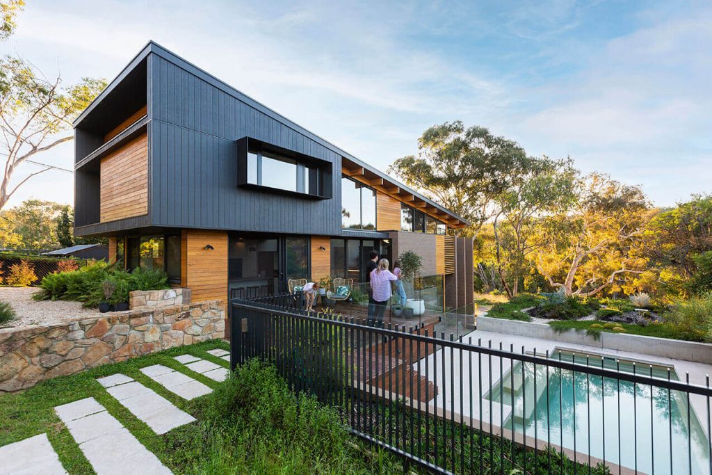 Image of a two storey house with raked roofline and pool, energy rating of 6 stars by Powerhaus Engineering, designed by Rob Henry architects