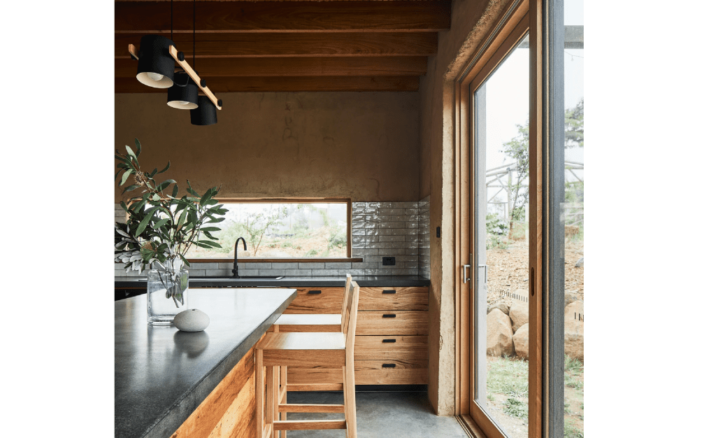 Image of a kitchen with double glazed composite windows showing the timber inside and alumnium outside