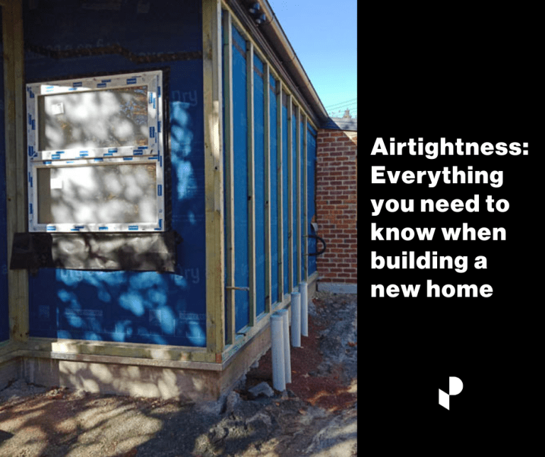 Airtightness wrap on a new home showing taping and windows.