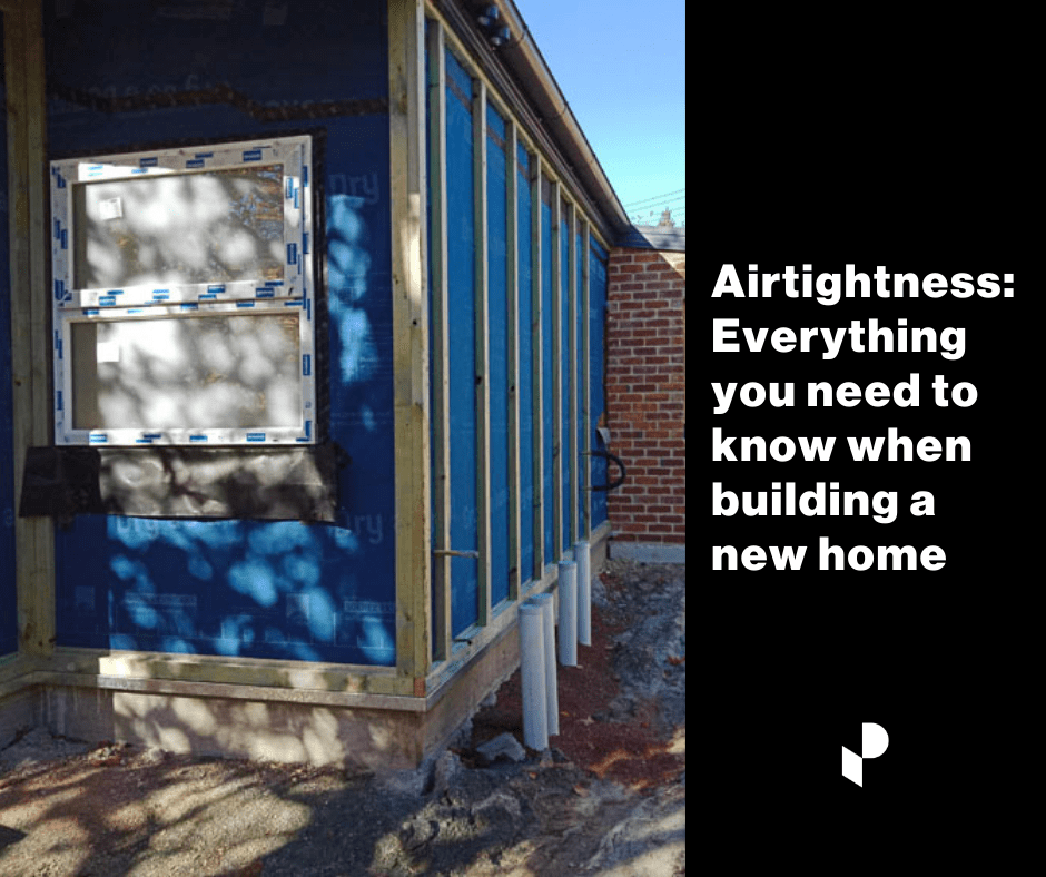 Airtightness wrap on a new home showing taping and windows.