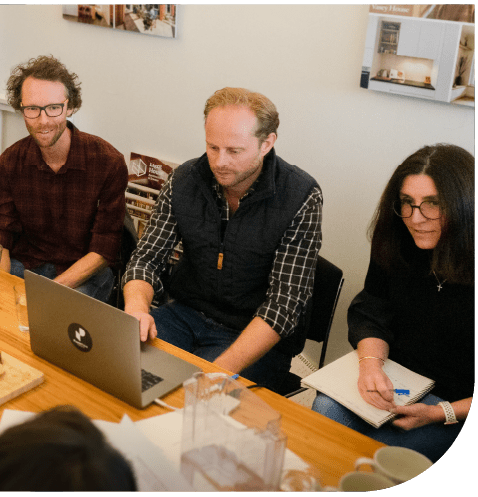 About Powerhaus Image of the energy efficiency expert team sitting at a table; Matt Godfrey, Andrew Pickard and Lisa Lockey
