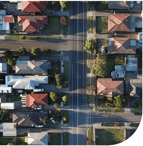 Aerial view of an Australian suburb with houses and roads for Powerhaus Engineering
